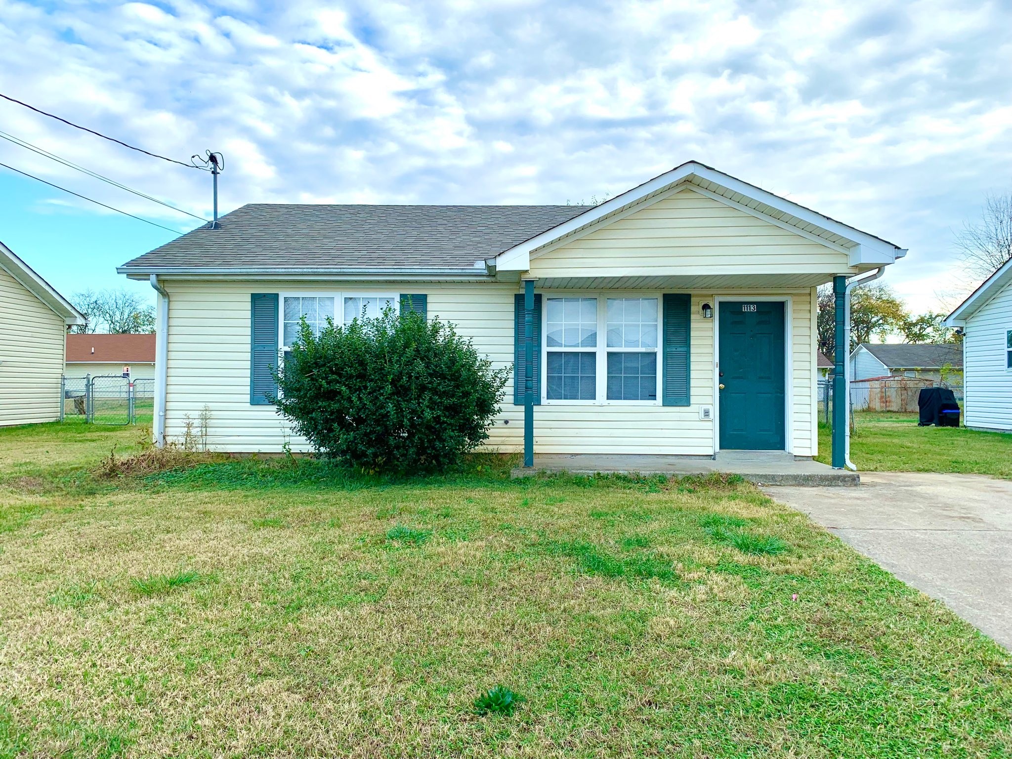 1113 Keith Avenue Oak Grove, KY 42262 - Photo 1 of 19 a front view of a house with a garden