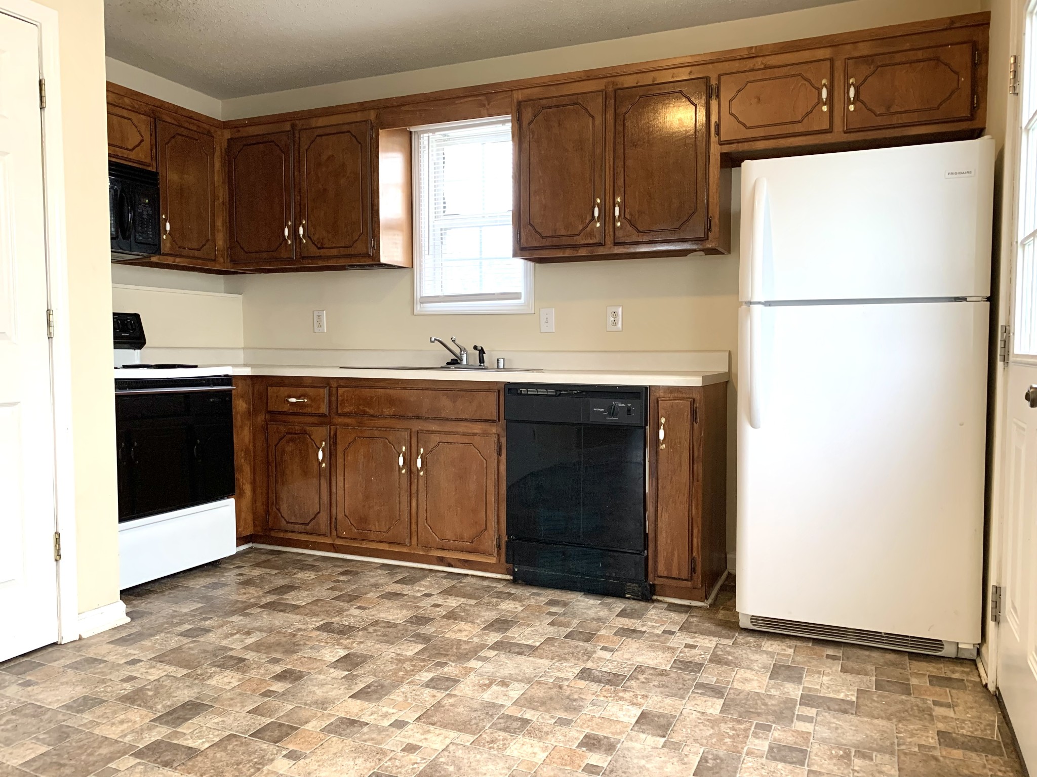 1113 Keith Avenue Oak Grove, KY 42262 - Photo 5 of 19 a kitchen with stainless steel appliances granite countertop a refrigerator and a sink