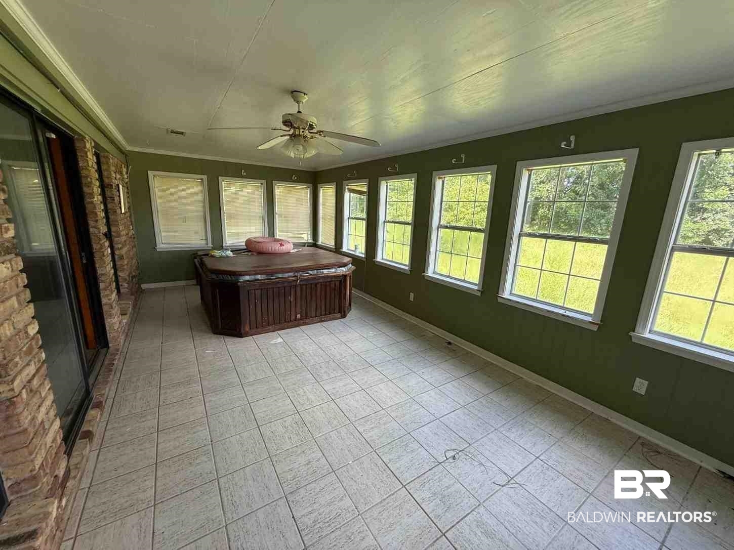 3721 Robertson Court Mobile, AL 36693 - Photo 16 of 22 Sunroom / solarium featuring crown molding and a jacuzzi
