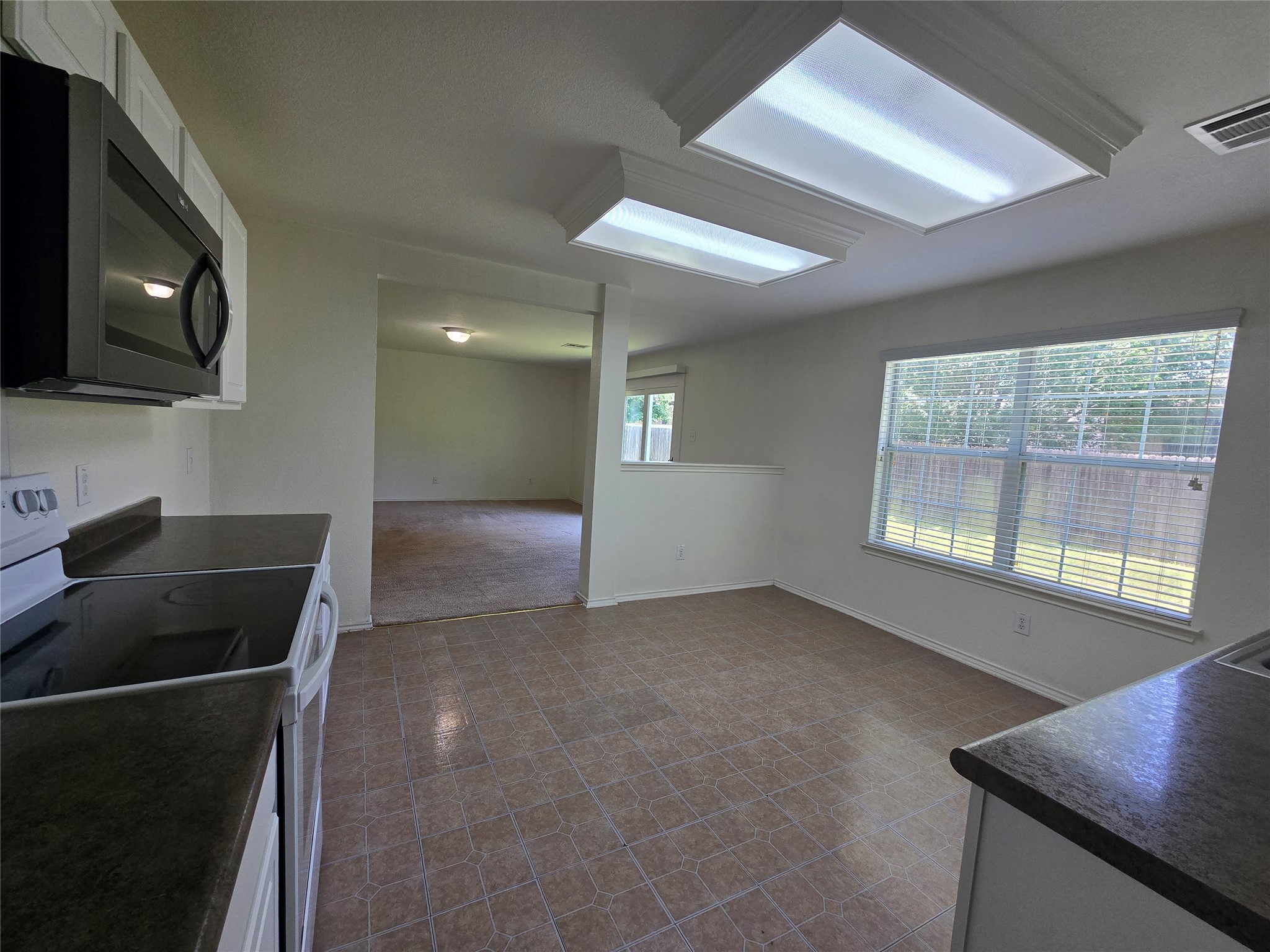 2021 Rim Rock Drive Leander, TX 78641 - Photo 4 of 14 A well-equipped kitchen offers practical counter space and easy flow to adjacent living areas.