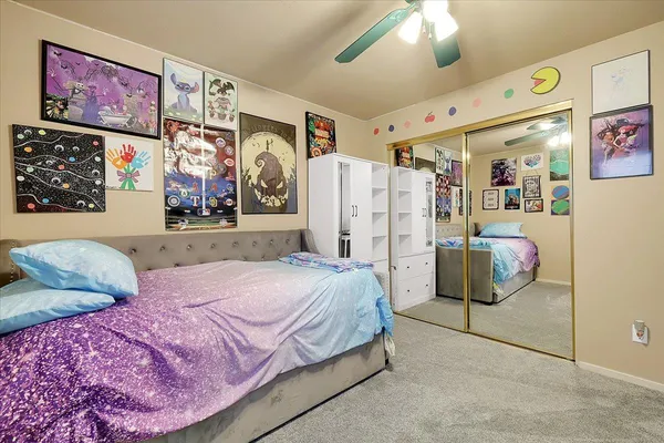 a bedroom with large bed and furniture