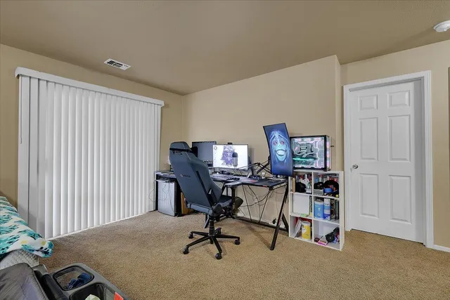 a view of a workspace with furniture