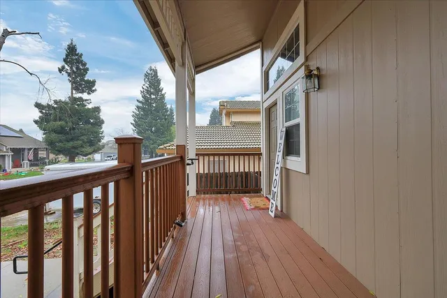 a view of wooden balcony with wooden floor and fence
