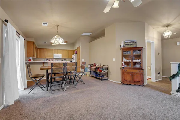 a view of a livingroom with furniture and a window