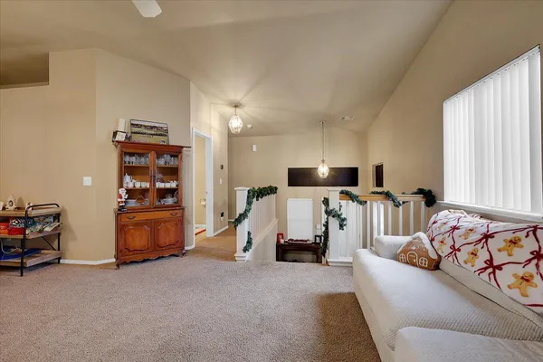 a bed room with furniture and a flat screen tv