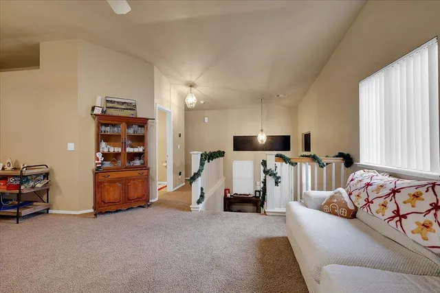 a bed room with furniture and a flat screen tv