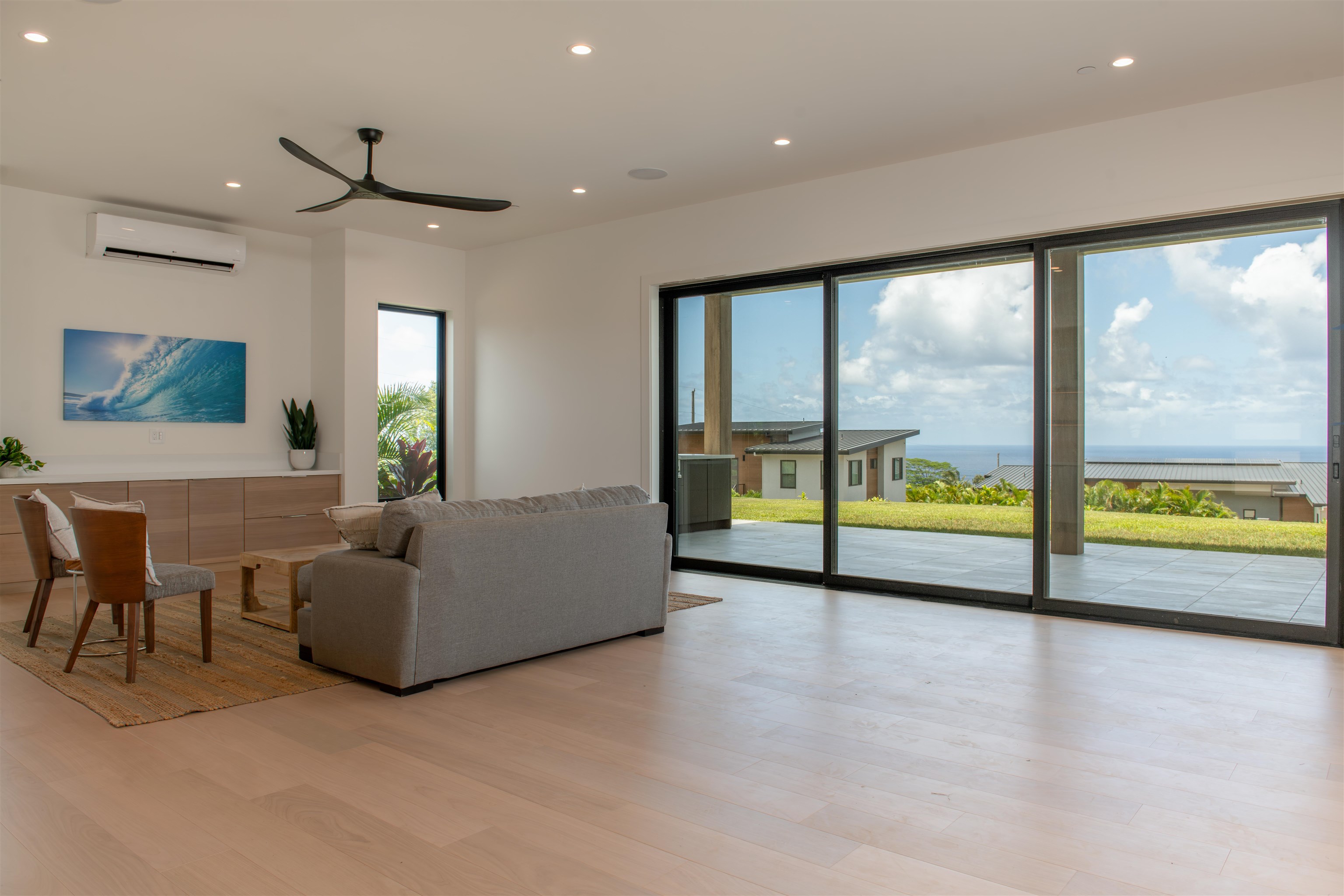 111 Mehana Road, Unit A Haiku, HI 96708 - Photo 21 of 50 a view of an empty room with a floor to ceiling window and a projector