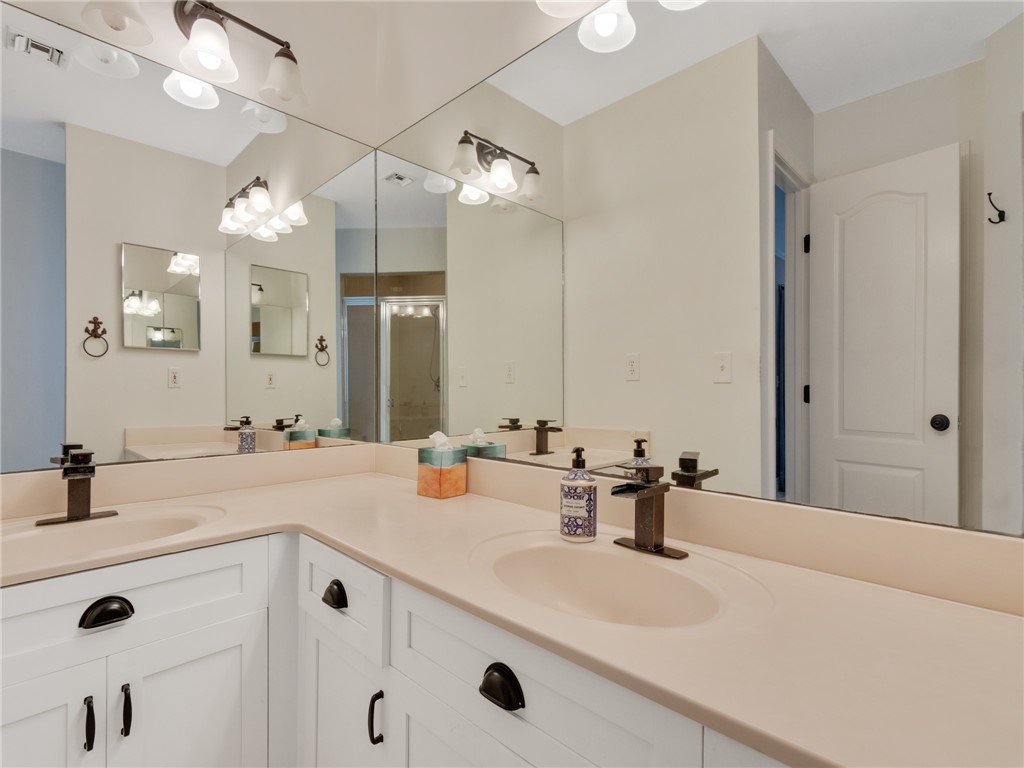 1370 St Davids Lane Vero Beach, FL 32967 - Photo 18 of 36 a bathroom with a sink double vanity and a mirror