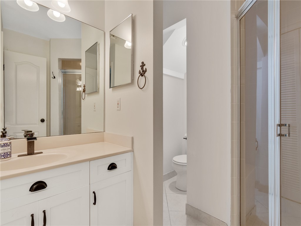 1370 St Davids Lane Vero Beach, FL 32967 - Photo 19 of 36 a bathroom with a sink mirror and shower