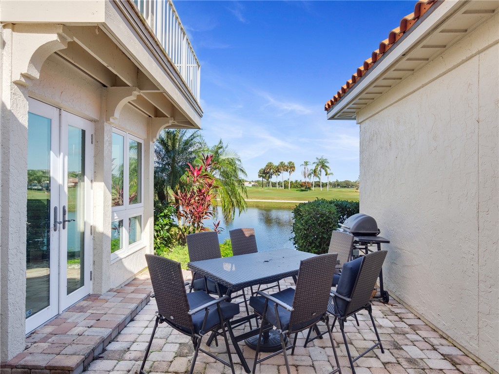 1370 St Davids Lane Vero Beach, FL 32967 - Photo 2 of 36 a view of a dining table and chairs in the balcony