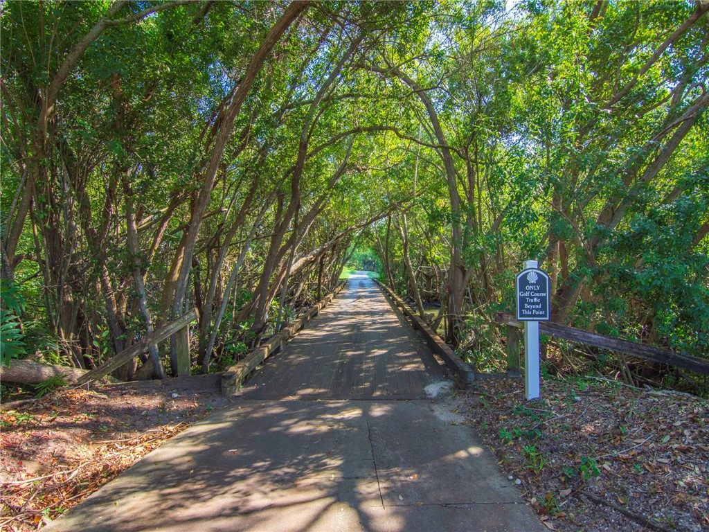 1370 St Davids Lane Vero Beach, FL 32967 - Photo 25 of 36 a street view with large trees