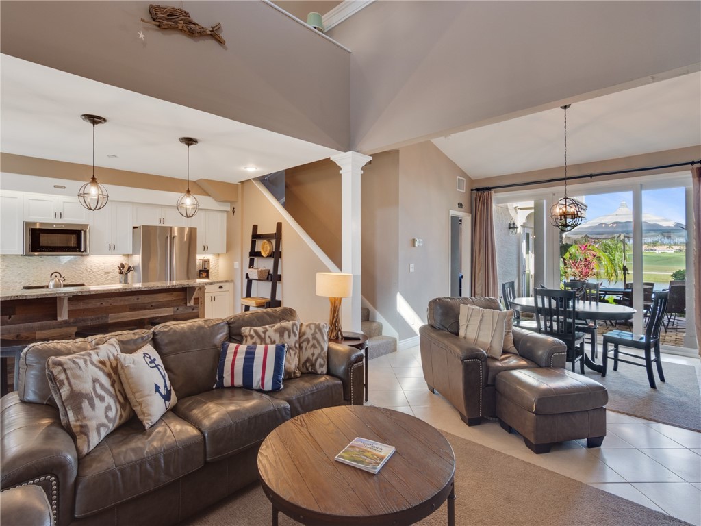 1370 St Davids Lane Vero Beach, FL 32967 - Photo 8 of 36 a living room with furniture kitchen view and a large window