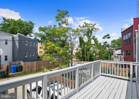 1260 Penn Street Northeast Washington, DC 20002 - Photo 18 of 24 Sunny balcony with vibrant greenery.