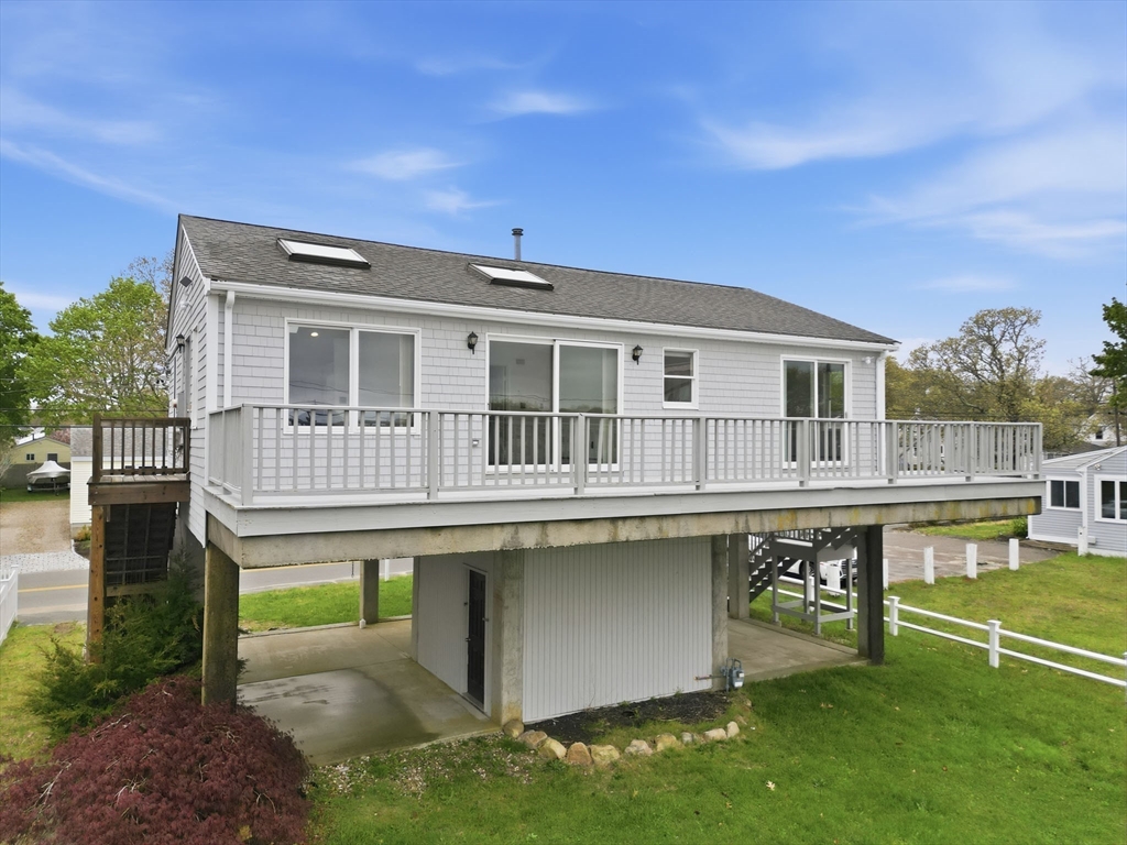 192 Swifts Beach Road Wareham, MA 02571 - Photo 2 of 38 a backyard of a house with table and chairs