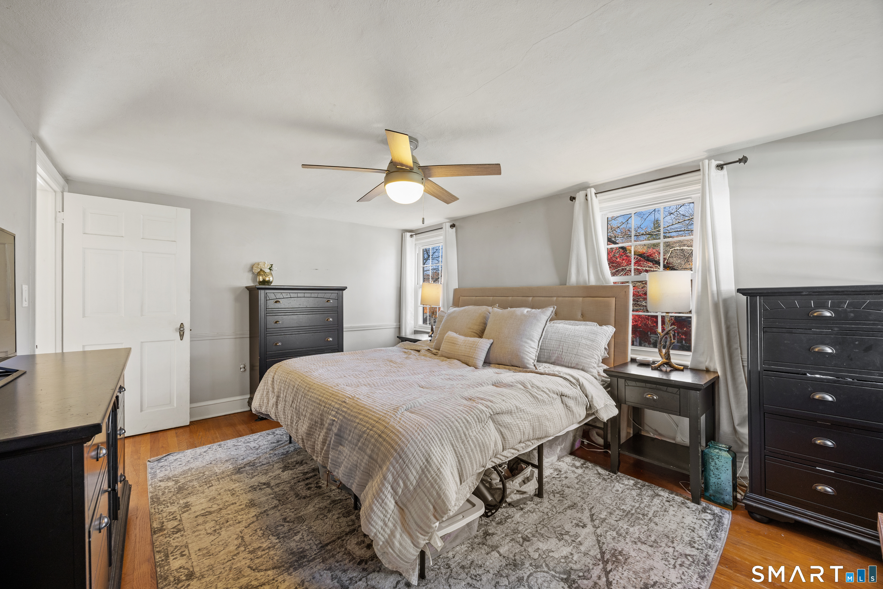 232 High Street Thomaston, CT 06787 - Photo 19 of 31 a bedroom with a bed and a dresser in it