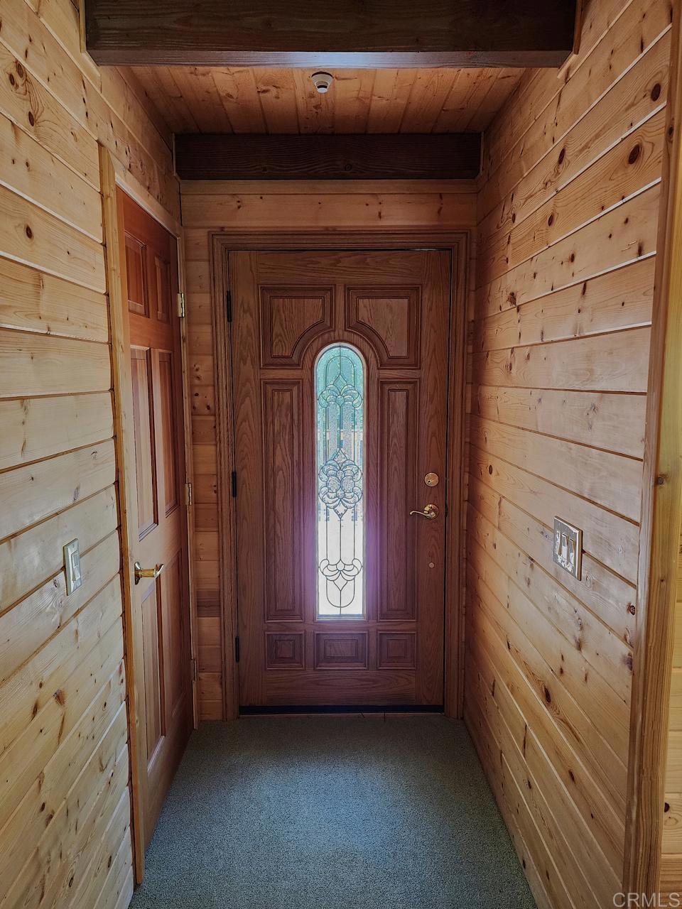 34675 Yuma Road Julian, CA 92036 - Photo 23 of 28 a view of a hallway with entryway windows and a kitchen view