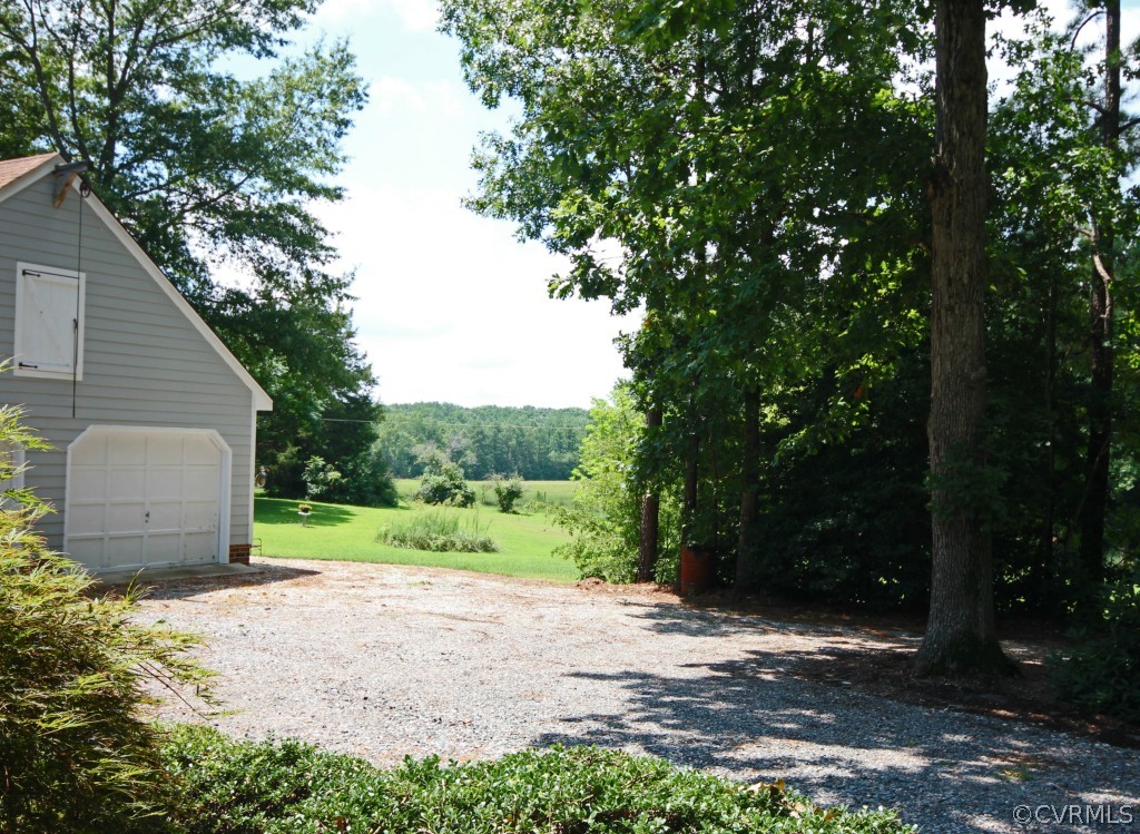 15321 Beach Road Chesterfield, VA 23838 - Photo 21 of 23 a view of a backyard with large trees