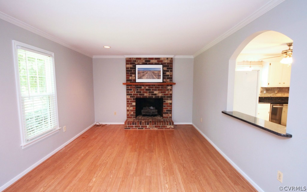 15321 Beach Road Chesterfield, VA 23838 - Photo 3 of 23 a view of an empty room with wooden floor and a window