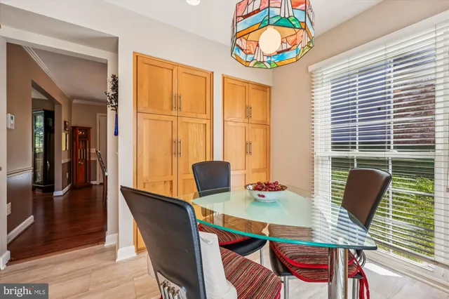 a view of a dining room with furniture and a window