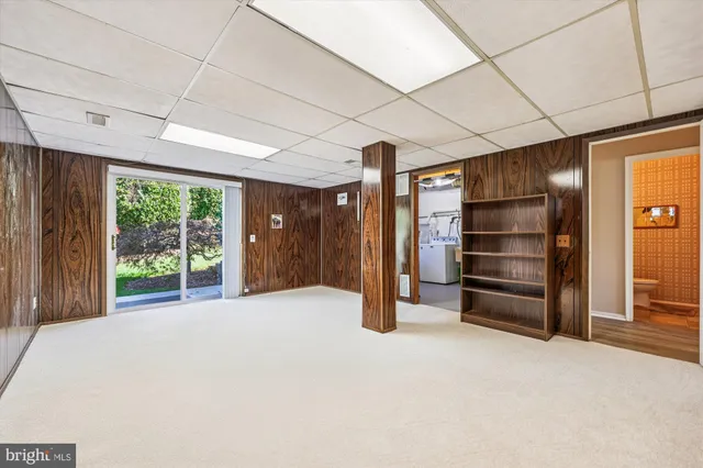 a view of room with furniture and a large window