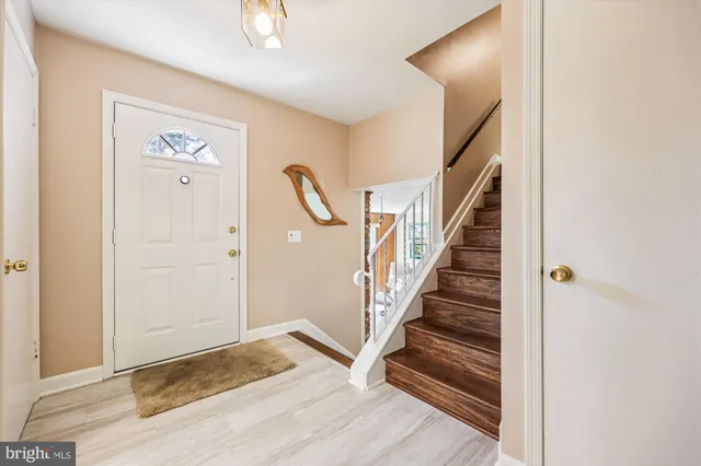 a bedroom with a large bed and a large window