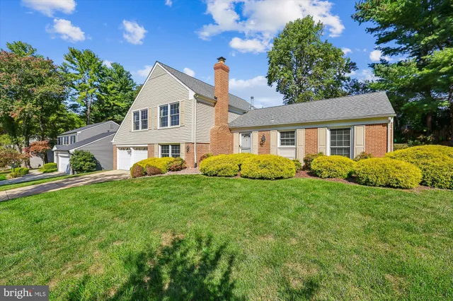 a view of backyard with outdoor seating and green space