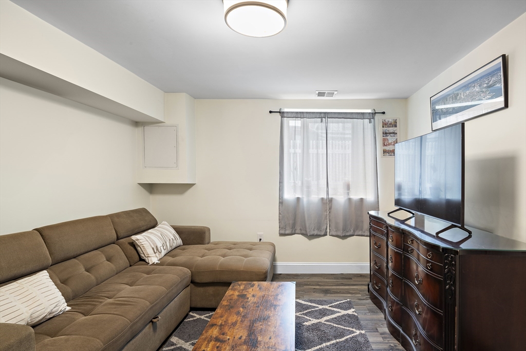 3 Clinton Road Revere, MA 02151 - Photo 15 of 19 a living room with furniture a flat screen tv and a window