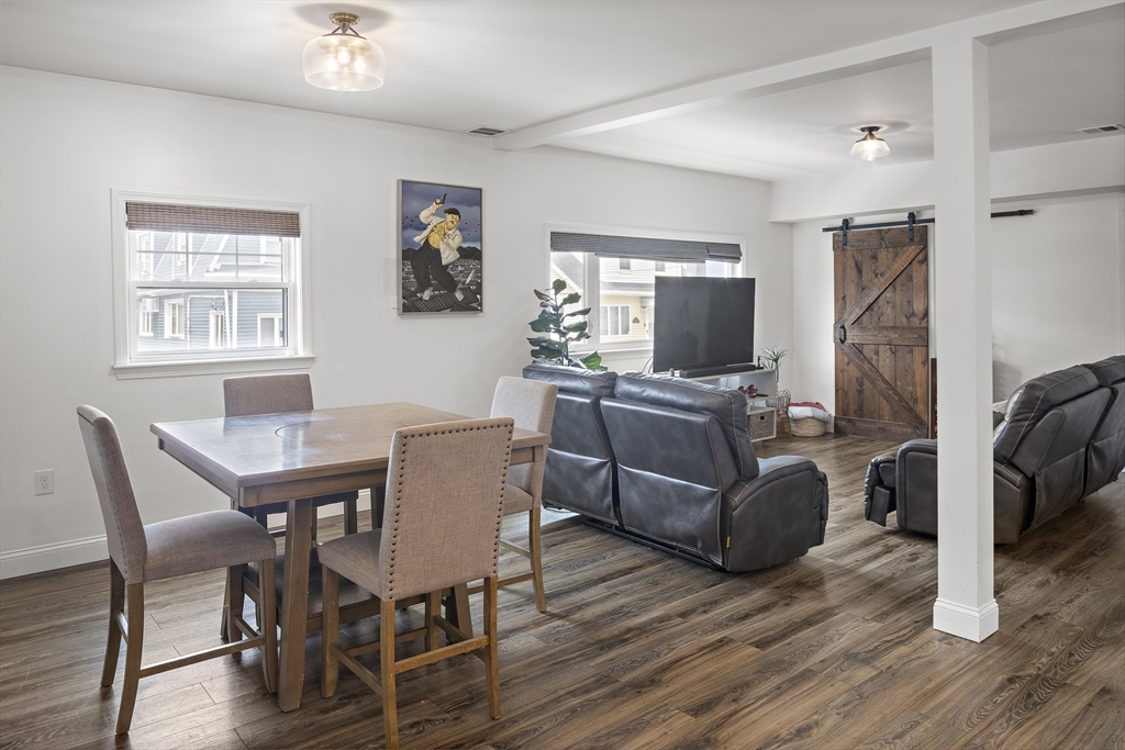 3 Clinton Road Revere, MA 02151 - Photo 2 of 19 a view of a livingroom with furniture and a flat screen tv