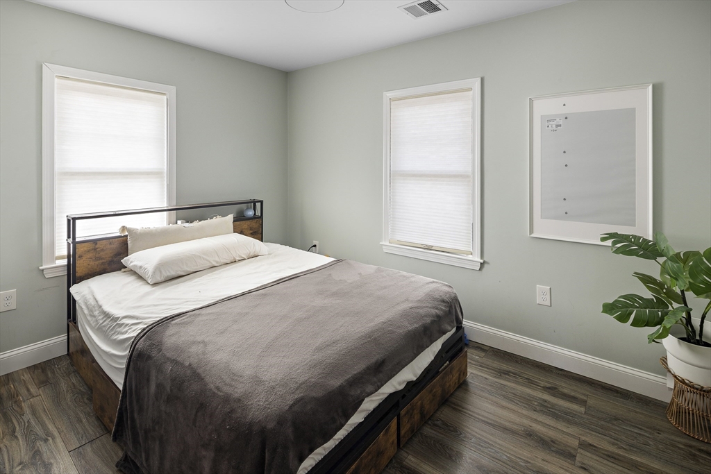 3 Clinton Road Revere, MA 02151 - Photo 6 of 19 a bedroom with a bed and a potted plant