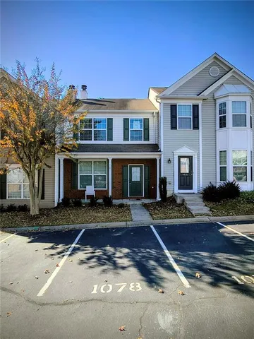 a front view of a house with yard