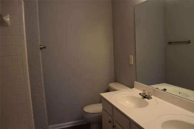 a bathroom with a sink toilet and vanity