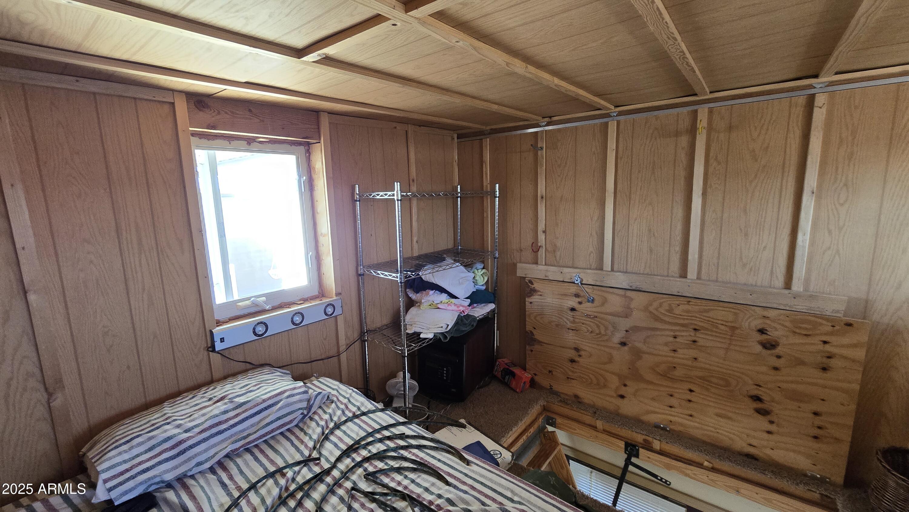 17200 West Bell Road, Unit 1519 Surprise, AZ 85374 - Photo 20 of 21 a bed room with a bed and a window