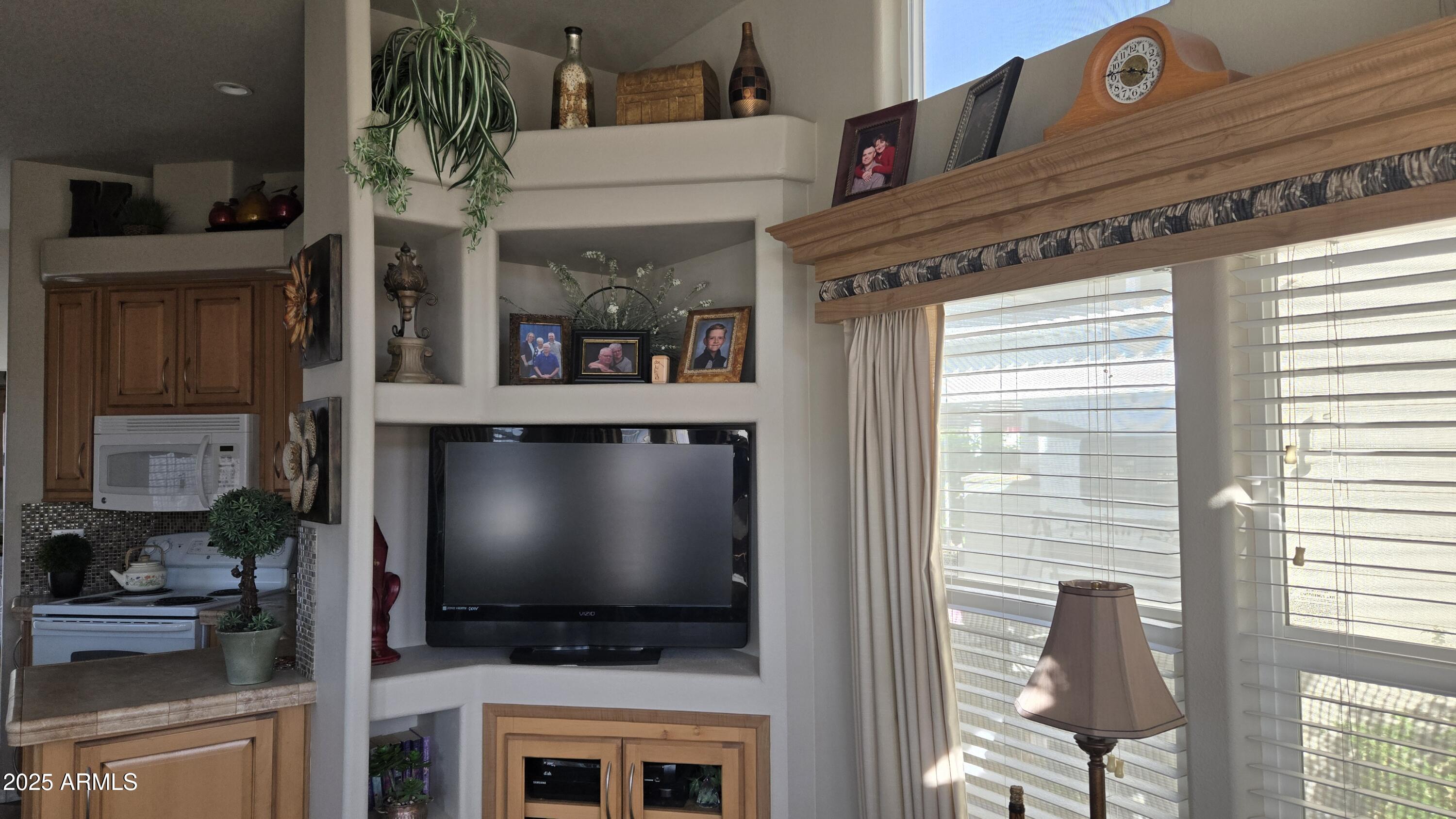 17200 West Bell Road, Unit 1519 Surprise, AZ 85374 - Photo 3 of 21 a view of a living room and a flat screen tv