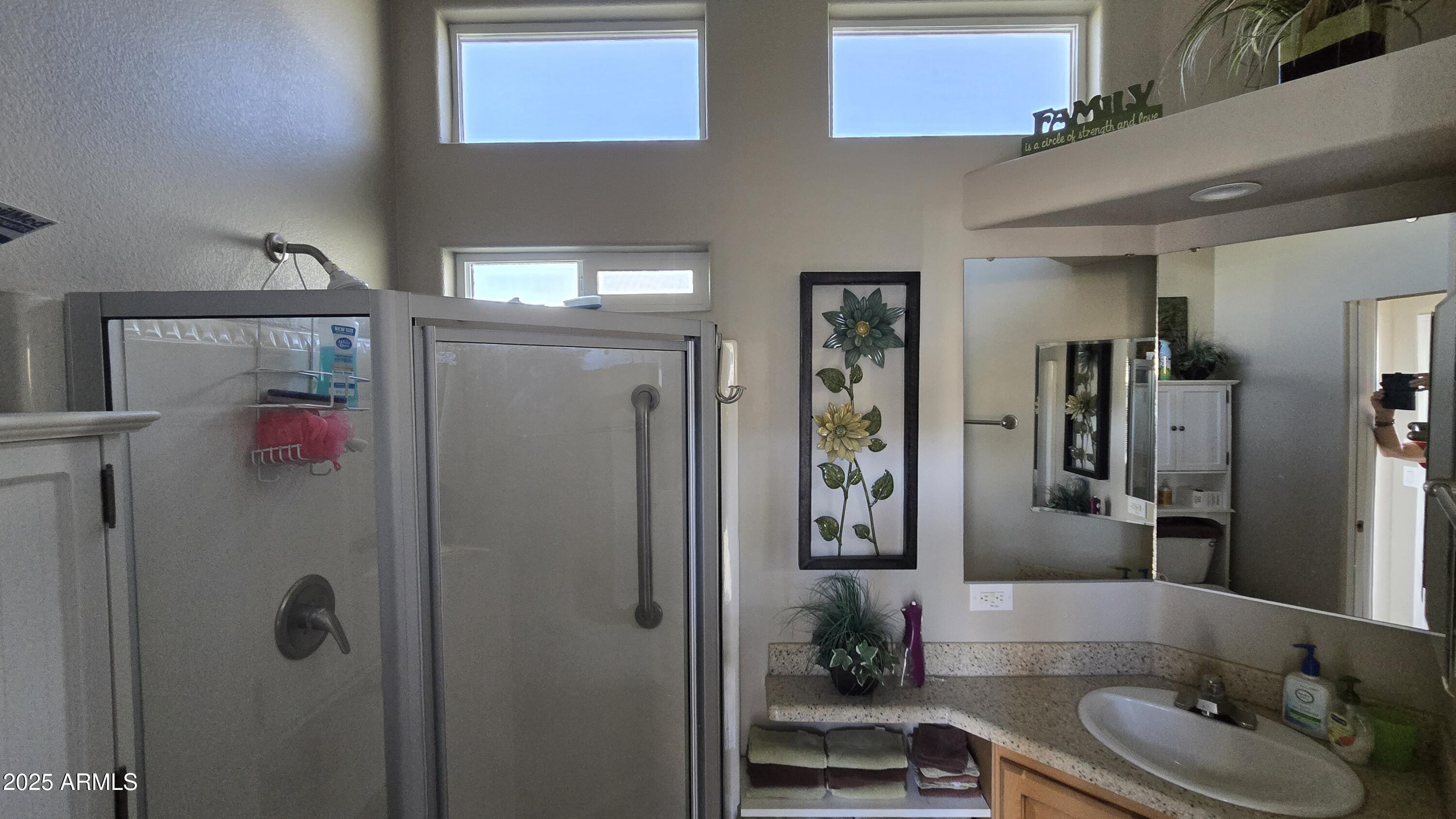 17200 West Bell Road, Unit 1519 Surprise, AZ 85374 - Photo 5 of 21 a bathroom with a sink and a mirror