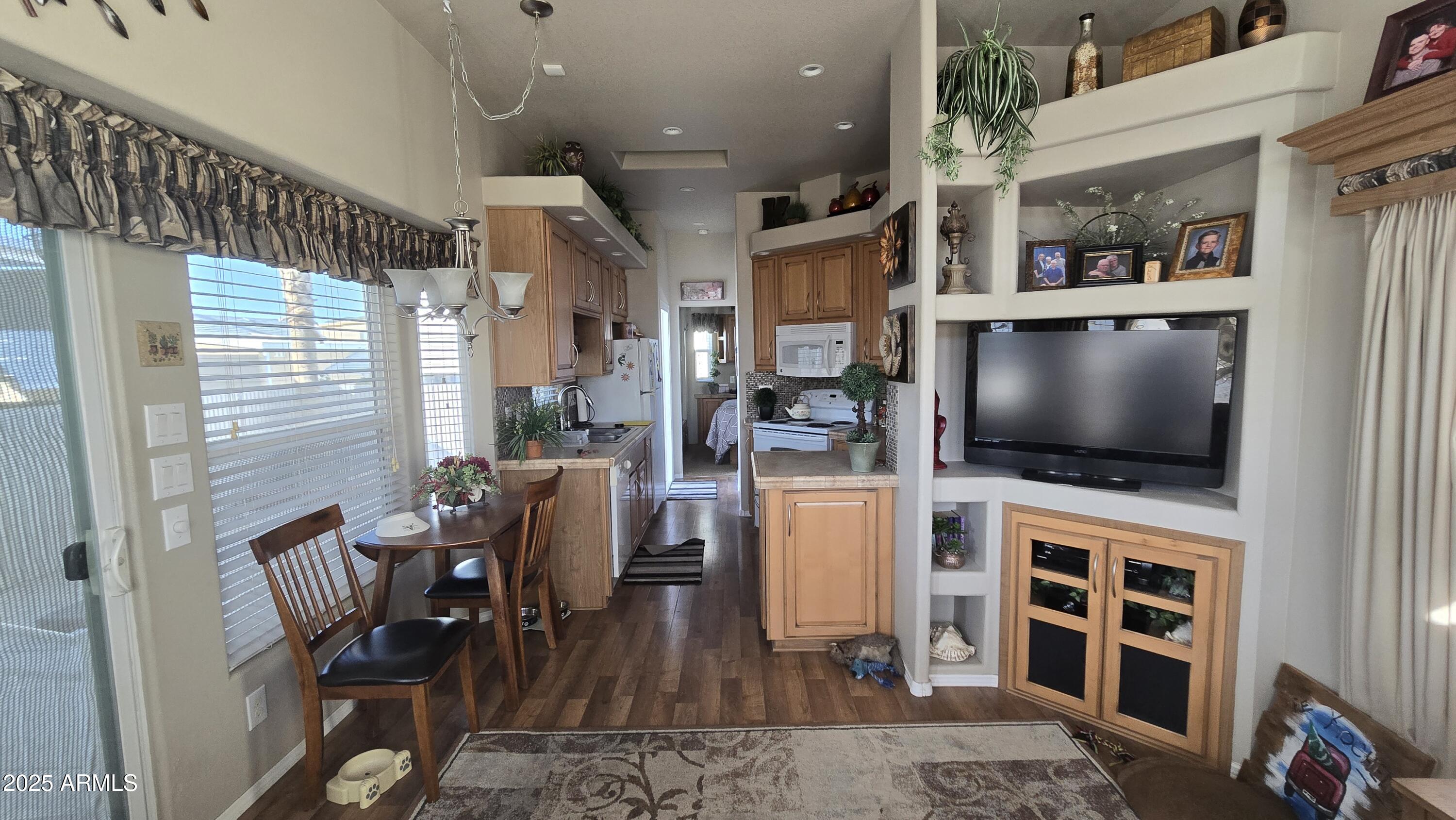 17200 West Bell Road, Unit 1519 Surprise, AZ 85374 - Photo 10 of 21 a living room with furniture and a flat screen tv