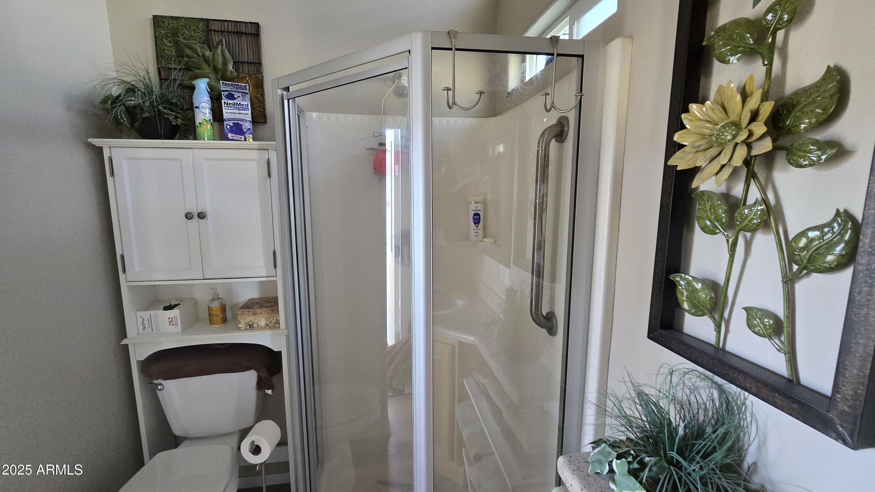 17200 West Bell Road, Unit 1519 Surprise, AZ 85374 - Photo 10 of 21 a bathroom with a toilet and a shower