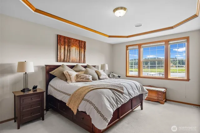 a spacious bedroom with a bed and a window