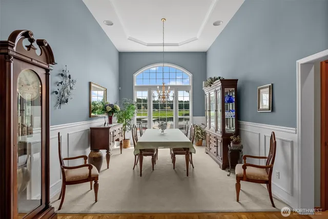 a view of a dining room with furniture window and outside view