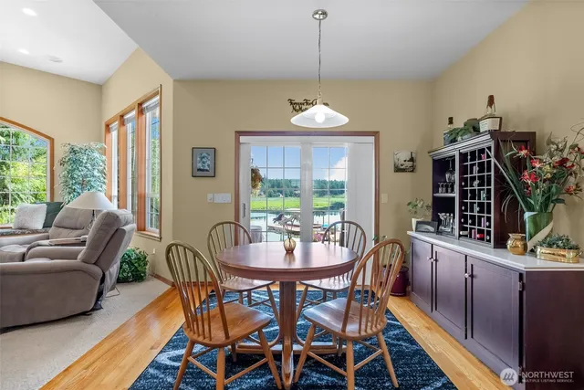 a view of a dining room with furniture window and outside view