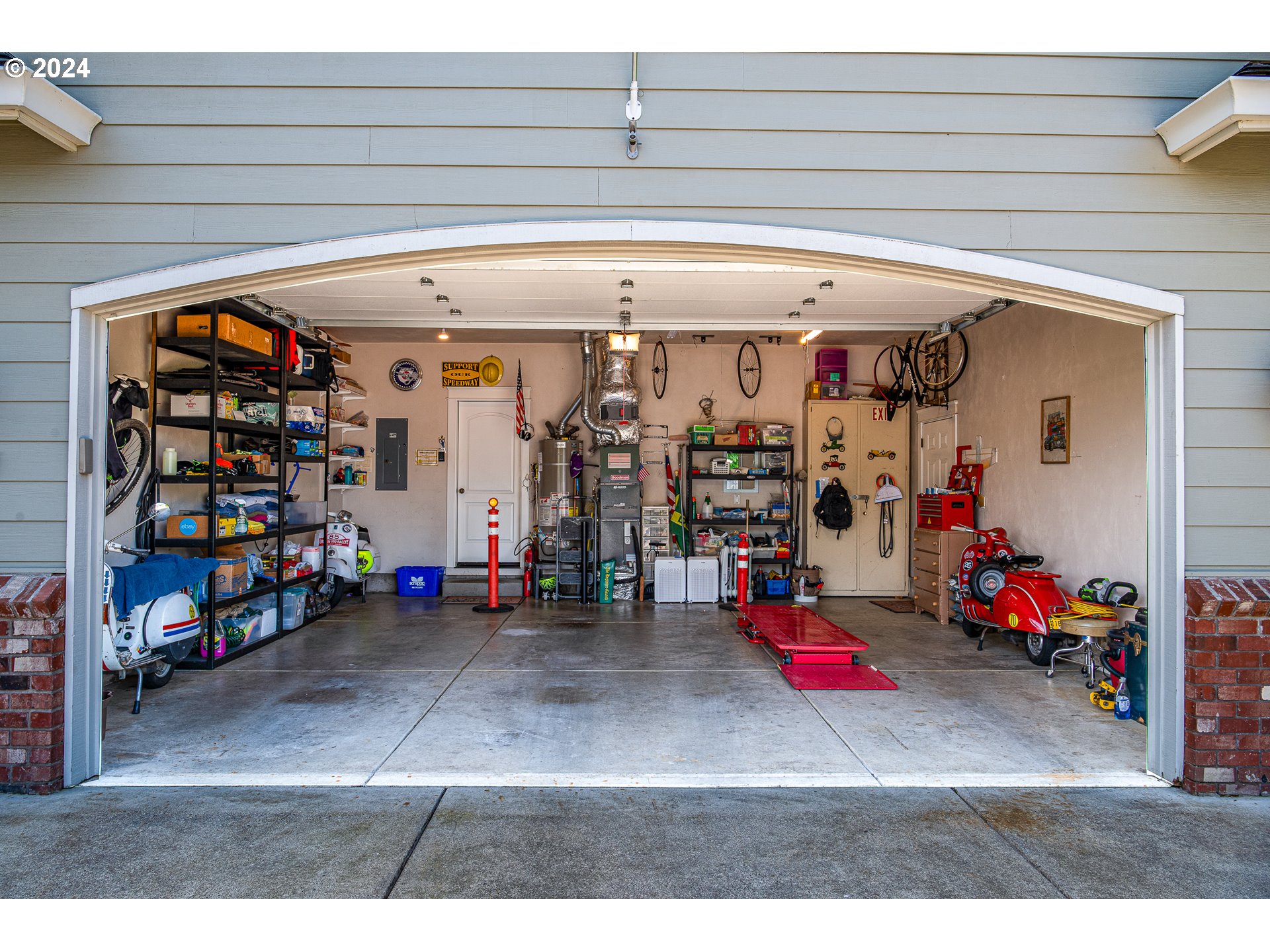 701 Blackstone Street Springfield, OR 97477 - Photo 28 of 40 a view of a garage with rack and bicycle