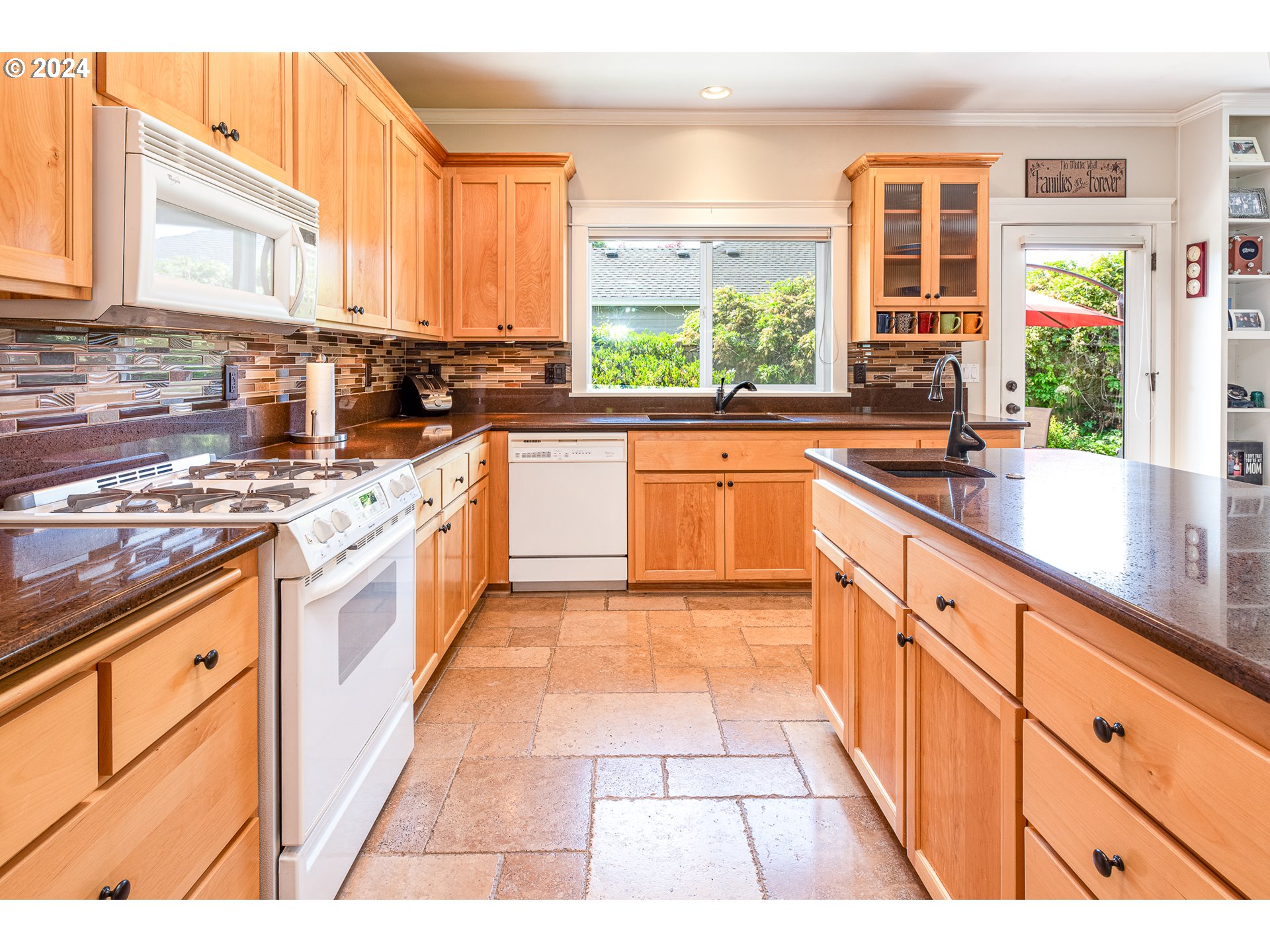 701 Blackstone Street Springfield, OR 97477 - Photo 8 of 40 a large kitchen with stainless steel appliances granite countertop a stove a sink and a granite counter tops