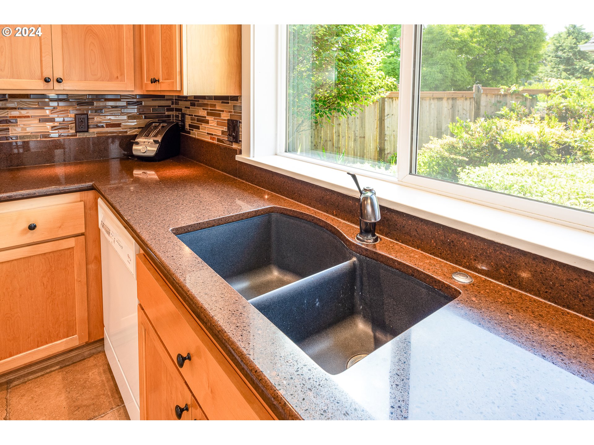 701 Blackstone Street Springfield, OR 97477 - Photo 10 of 40 a kitchen view with a sink and large window