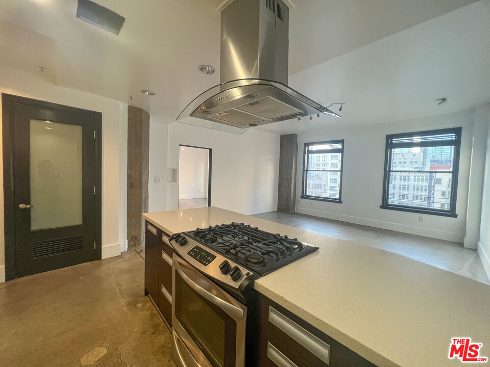 810 South Spring Street, Unit 801 Los Angeles, CA 90014 - Photo 1 of 21 a kitchen with stove and refrigerator