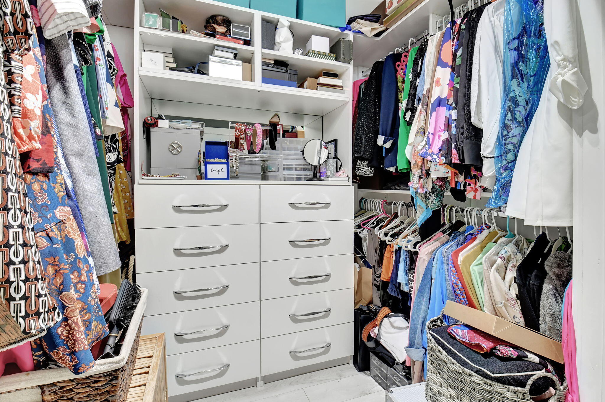2550 Northwest 52nd Street Boca Raton, FL 33496 - Photo 21 of 56 a view of walk in closet with clothes and shoes