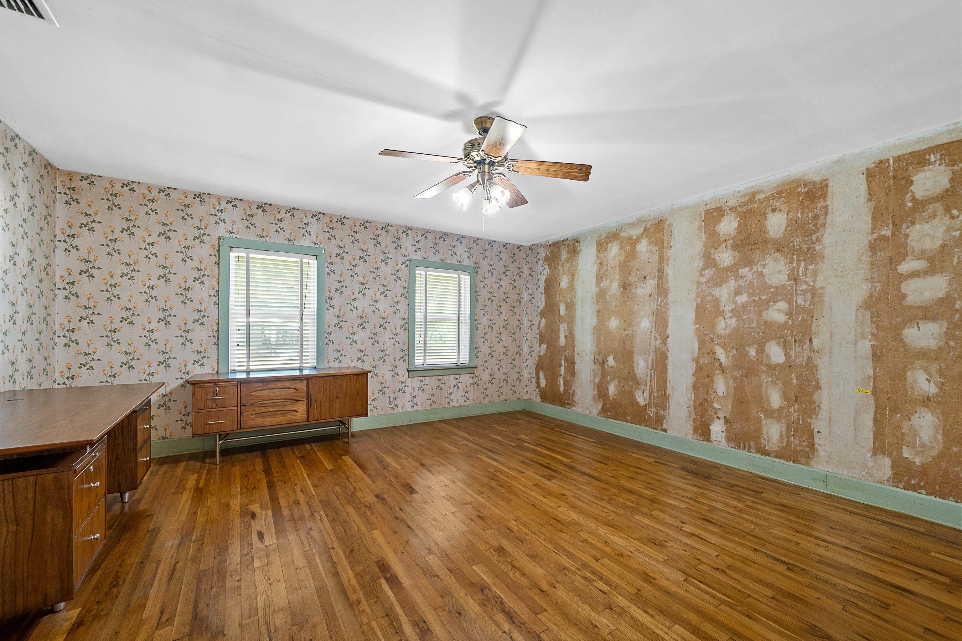 9350 Tompkins Road Stockton, AL 36579 - Photo 20 of 36 Empty room with dark wood finished floors and ceiling fan