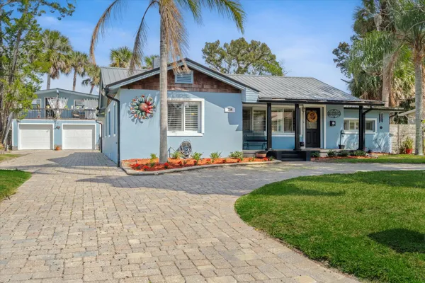 a front view of a house with swimming pool