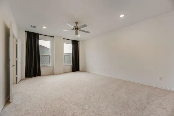 a view of an empty room with a bathroom