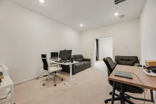 a work room with furniture and a window