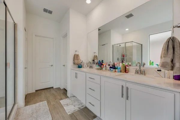a bathroom with a sink and mirror