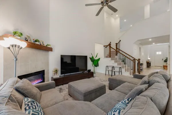 a living room with furniture and a flat screen tv